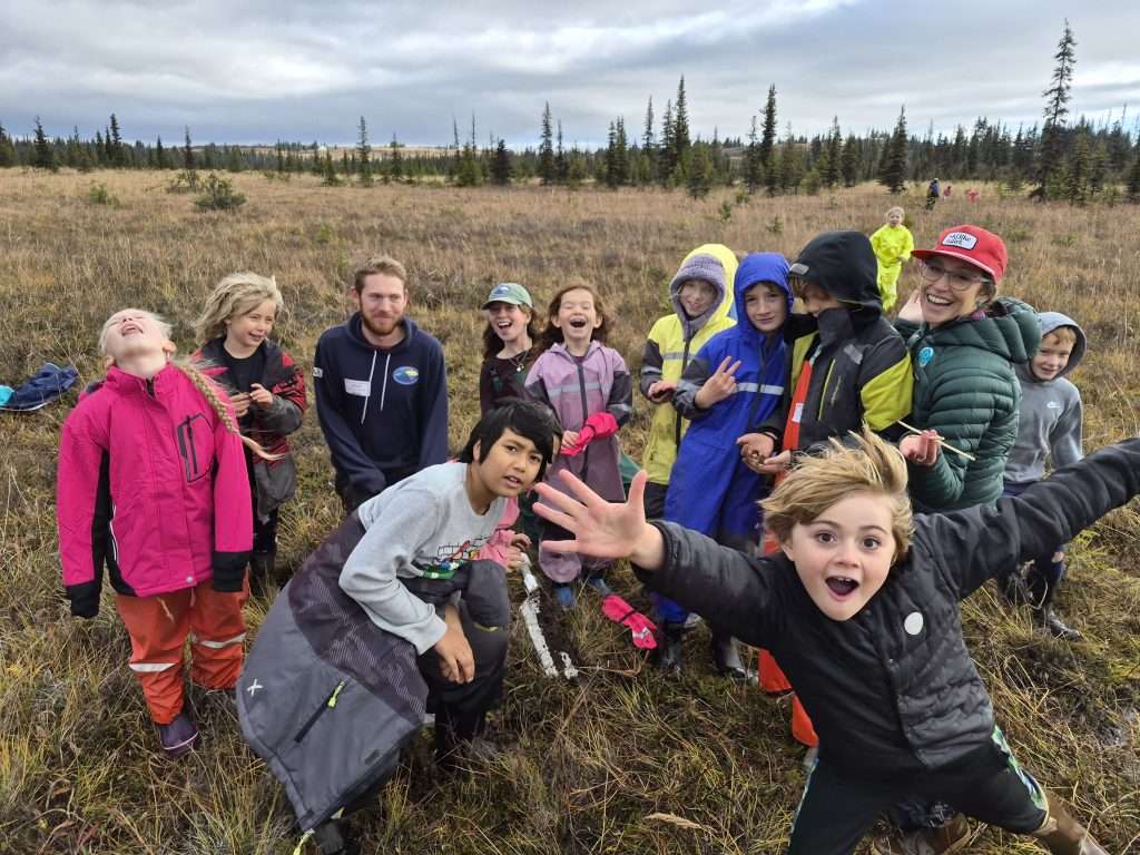 Kids look at core samples from Peatlands near McNeil Canyon Elementary